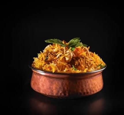 Authentic Lahori Biryani served in traditional style with golden rice, tender meat, and aromatic spices - Xpress Catering